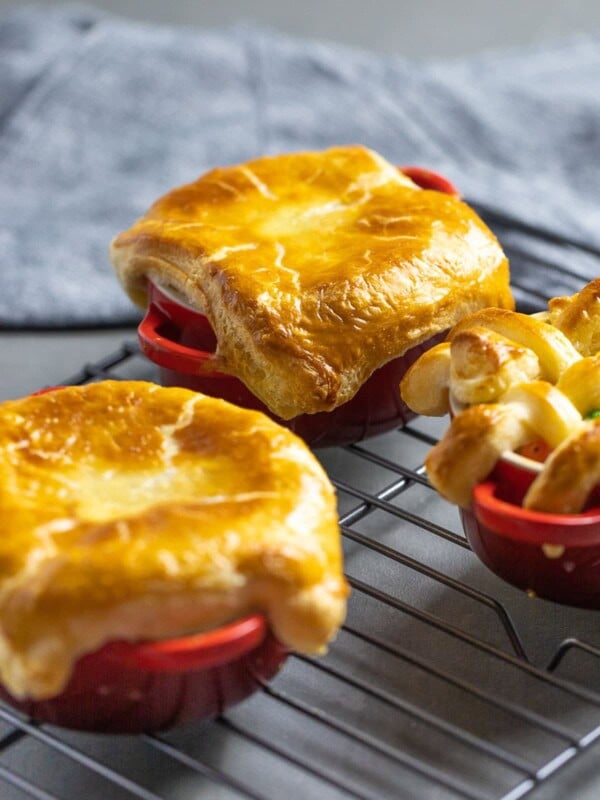 easy chicken pot pie with puff pastry in red ramekins