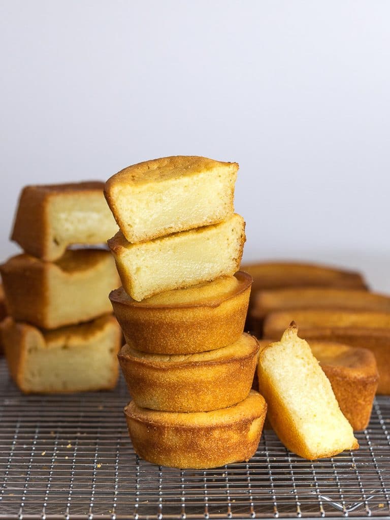 butter mochi stacked on a wire rack