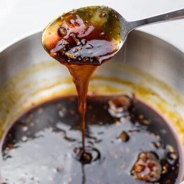 Sweet and tangy soy glaze on a spoon