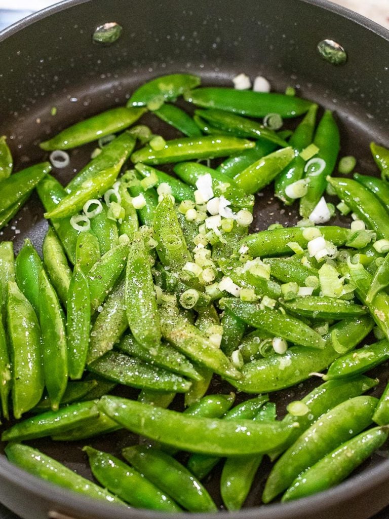 sugar snap peas sauteed in a pan