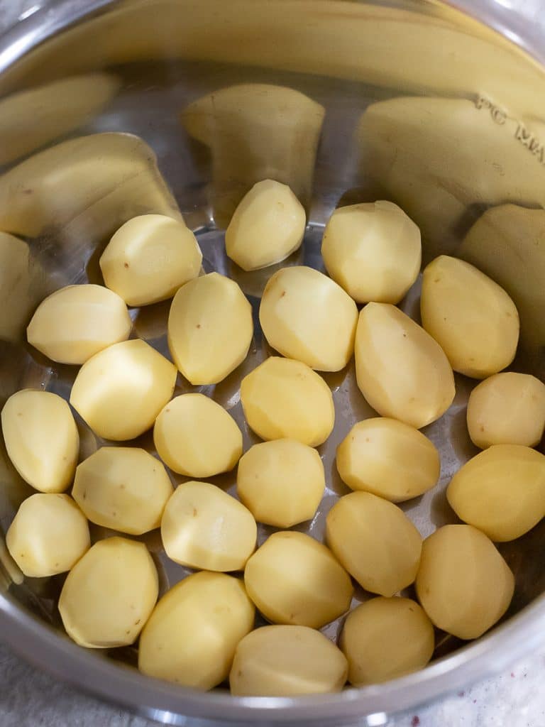 Peeled potatoes inside an instant pot
