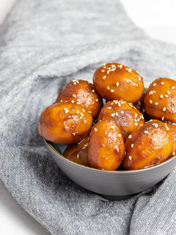 Korean Potato Side Dish, Gamja Jorim in a grey bowl on top of linen