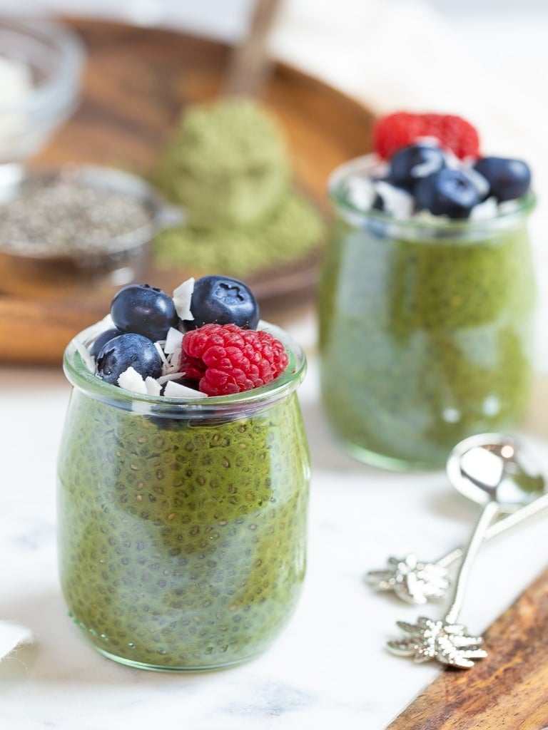 keto matcha chia pudding with blueberries and raspberries