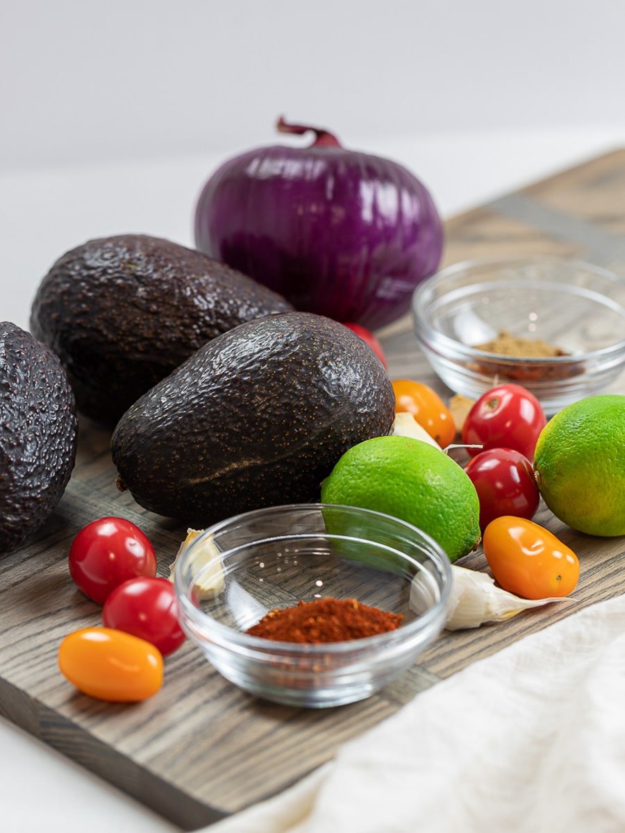 Ingredients for taco avocado boats, including avocados and taco spices.