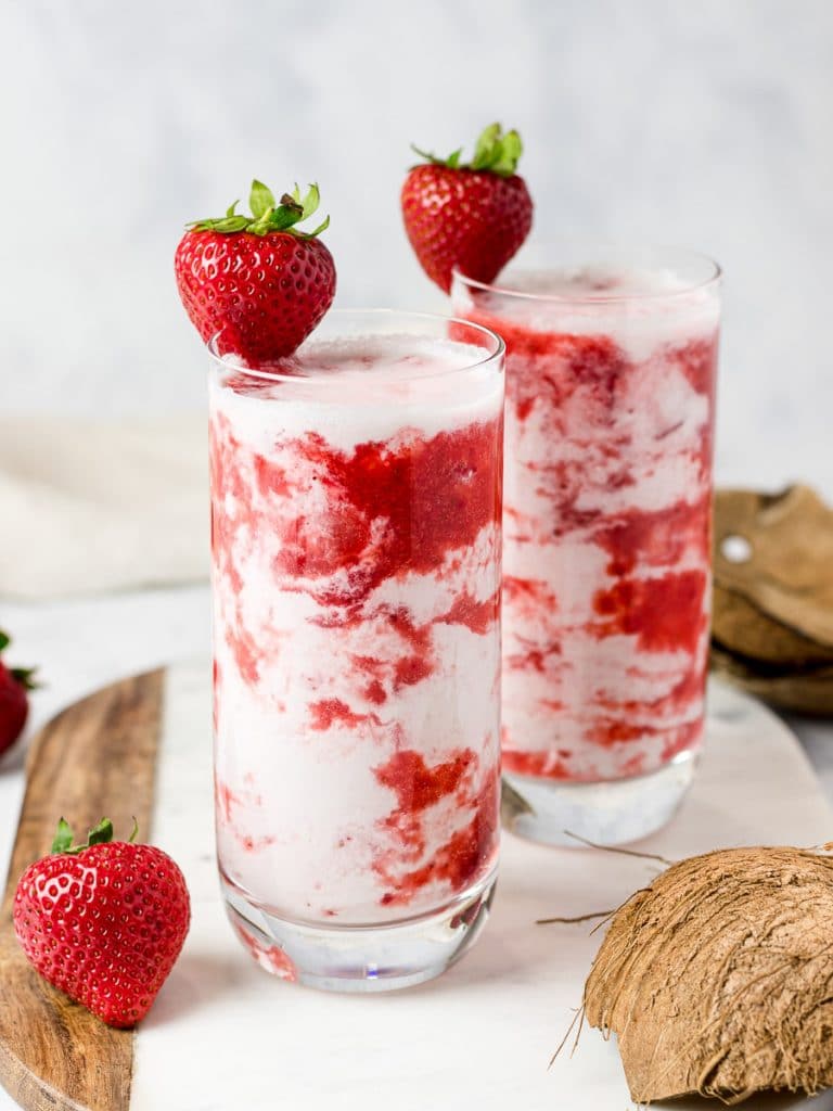 homemade Korean strawberry milk in two glasses with strawberries