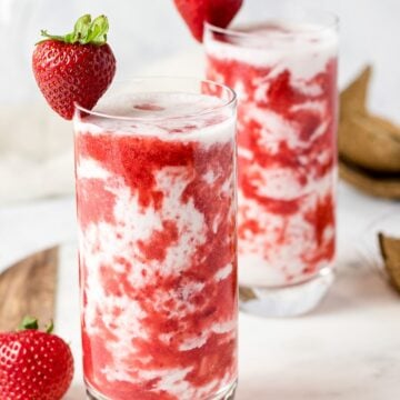 homemade Korean strawberry milk in two glasses with strawberries