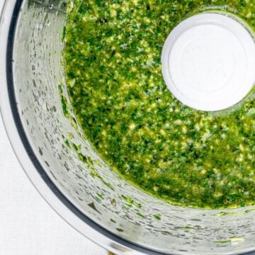 vegan pumpkin seed pesto with parsley and basil in a food processor