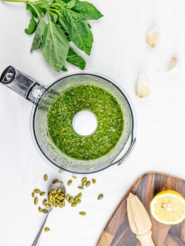 vegan pumpkin seed pesto with basil and parsley in a food processor