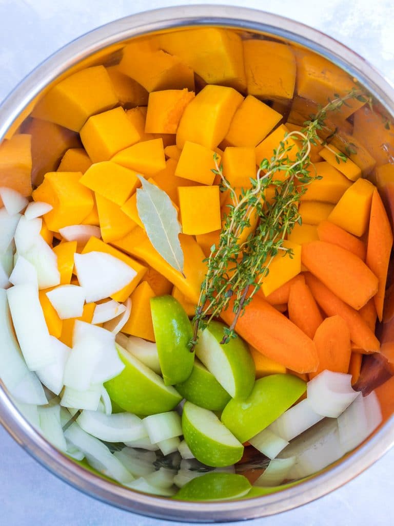 ingredients for instant pot vegan butternut squash soup in an instant pot container