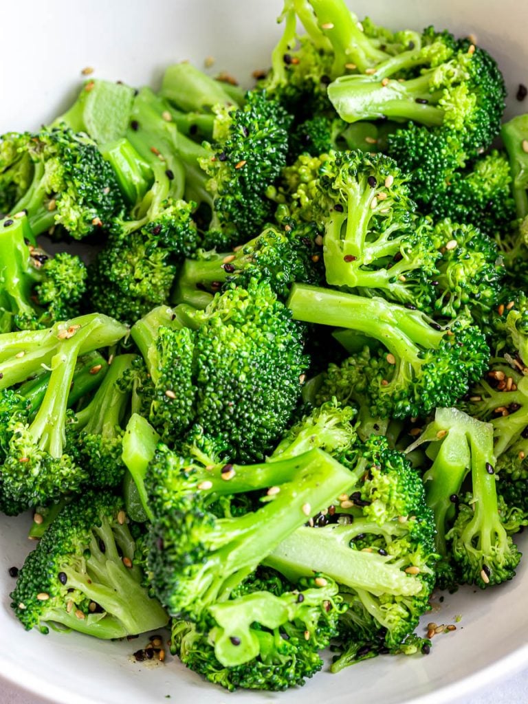 Asian sesame broccoli salad in a white bowl