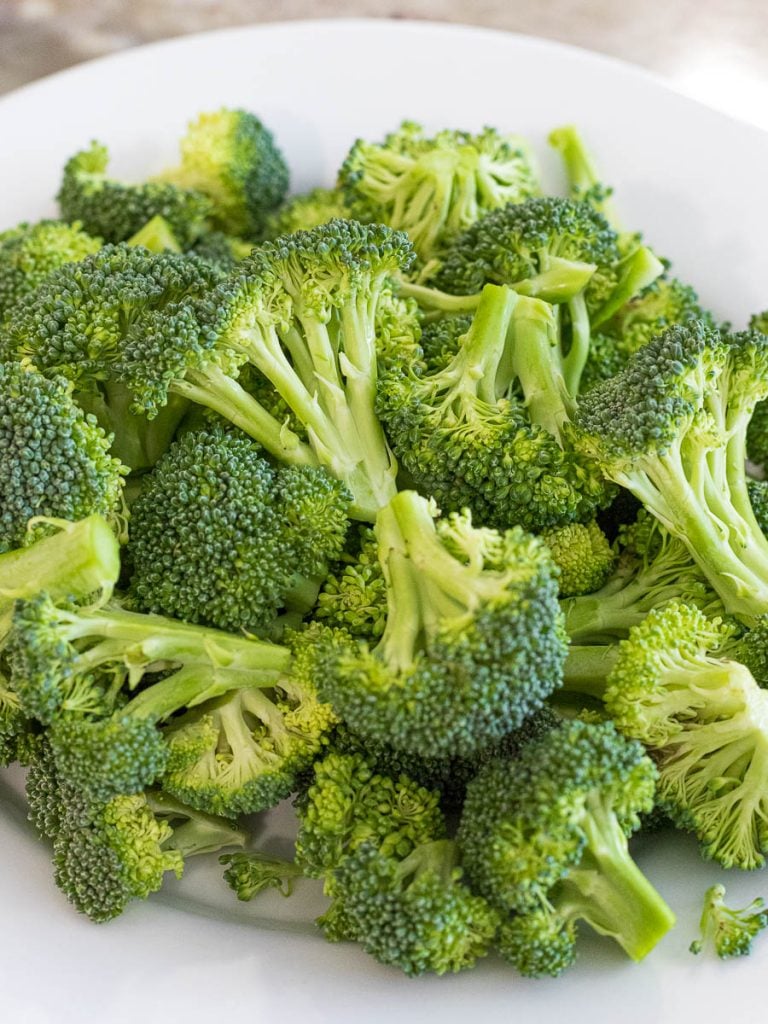 broccoli florets on a white plate