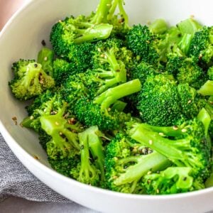 Asian sesame broccoli salad in a white bowl