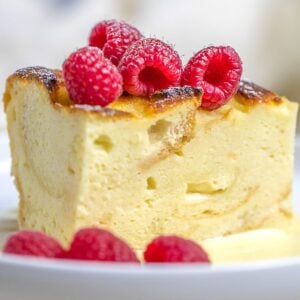 custard bread pudding with vanilla sauce and raspberries