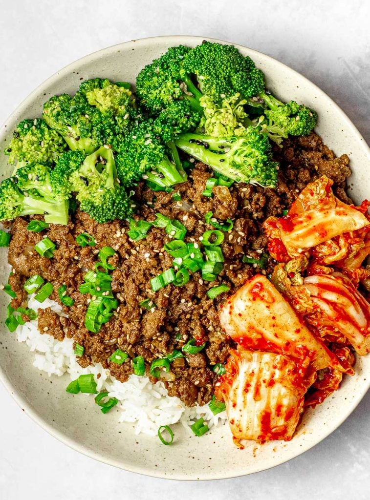 Korean beef bowl with broccoli, kimchi, and scallions; bulgogi bowl