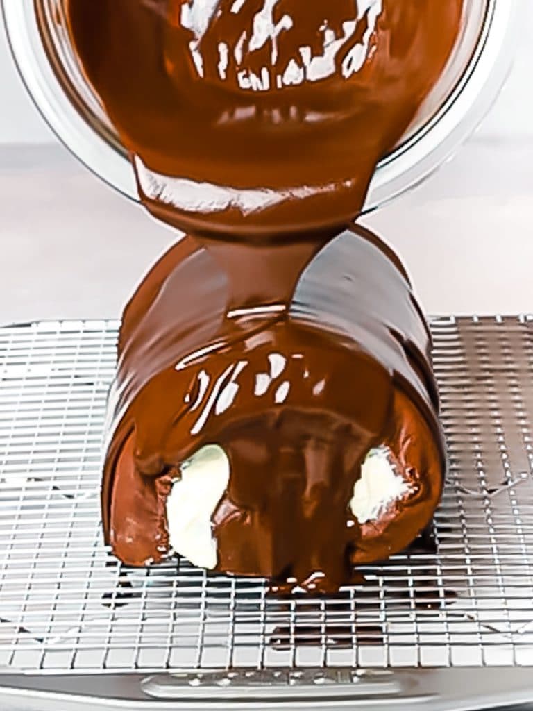 chocolate ganache poured over a cake for glaze
