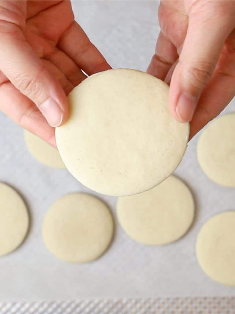 soft cut out sugar cookies held in hand