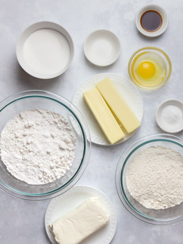 ingredients for soft cream cheese sugar cookies in glass bowls