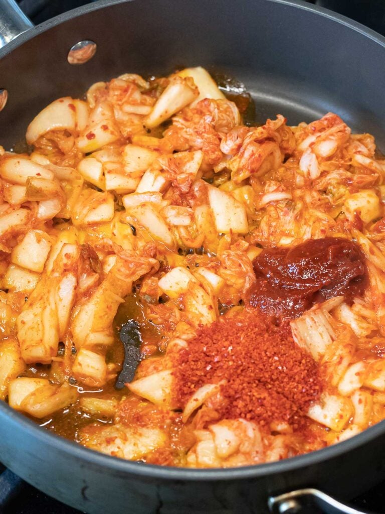 chopped kimchi, gochujang, and Korean red pepper flakes in a nonstick pan