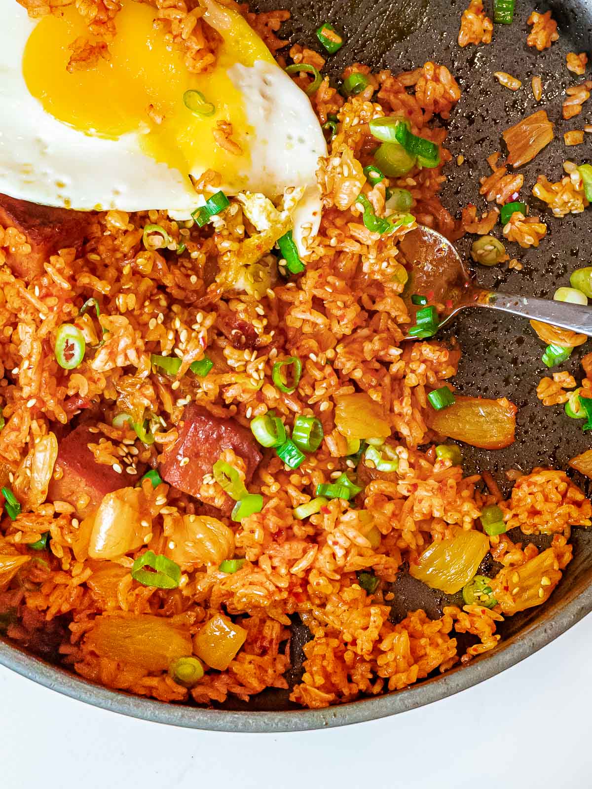 overhead of kimchi spam fried rice and a fried egg