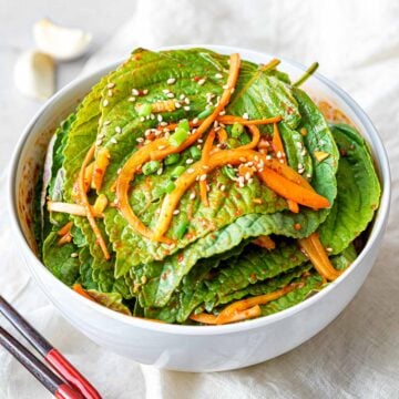 Korean perilla leaf kimchi marinated in a spicy garlic soy sauce with shredded carrots
