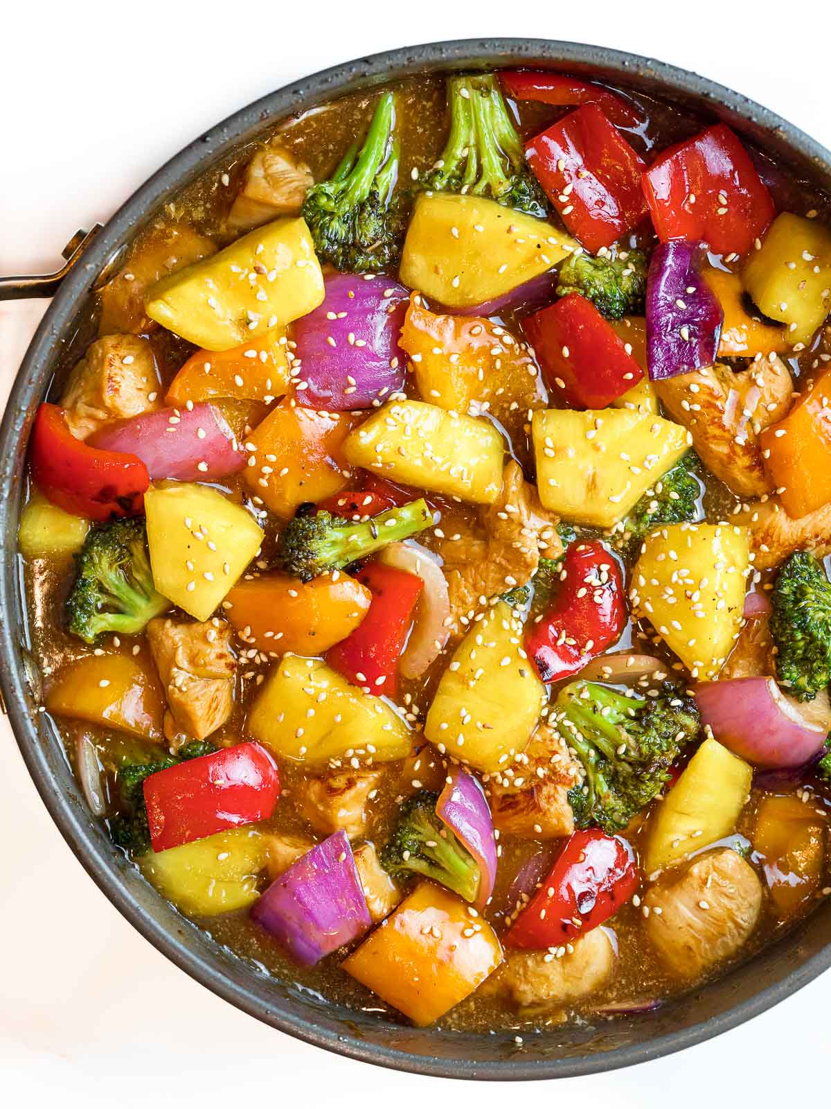 summer pineapple chicken stir fry with tangy teriyaki sauce and vegetables