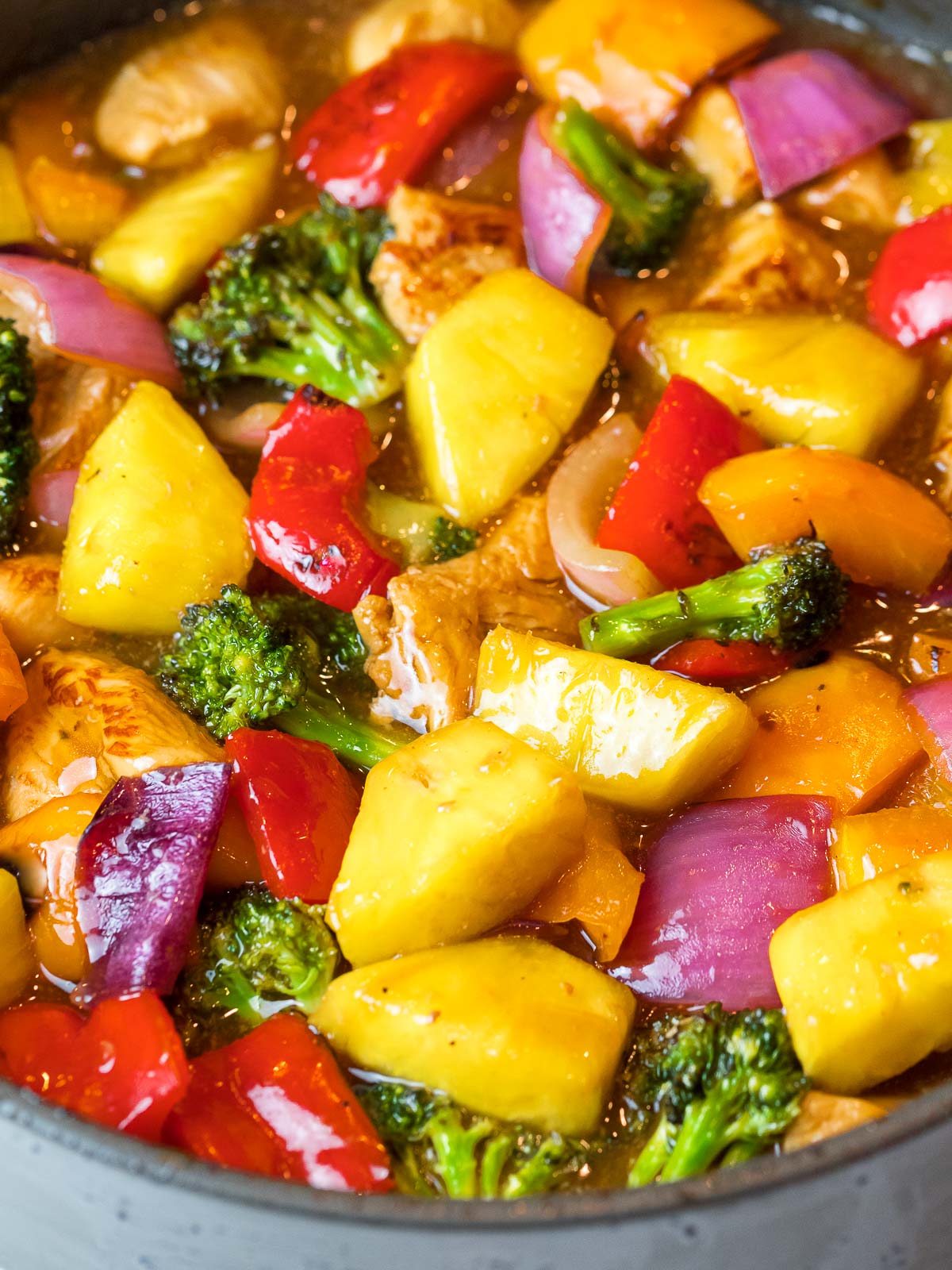 Hawaiian pineapple chicken stir fry with red peppers and broccoli