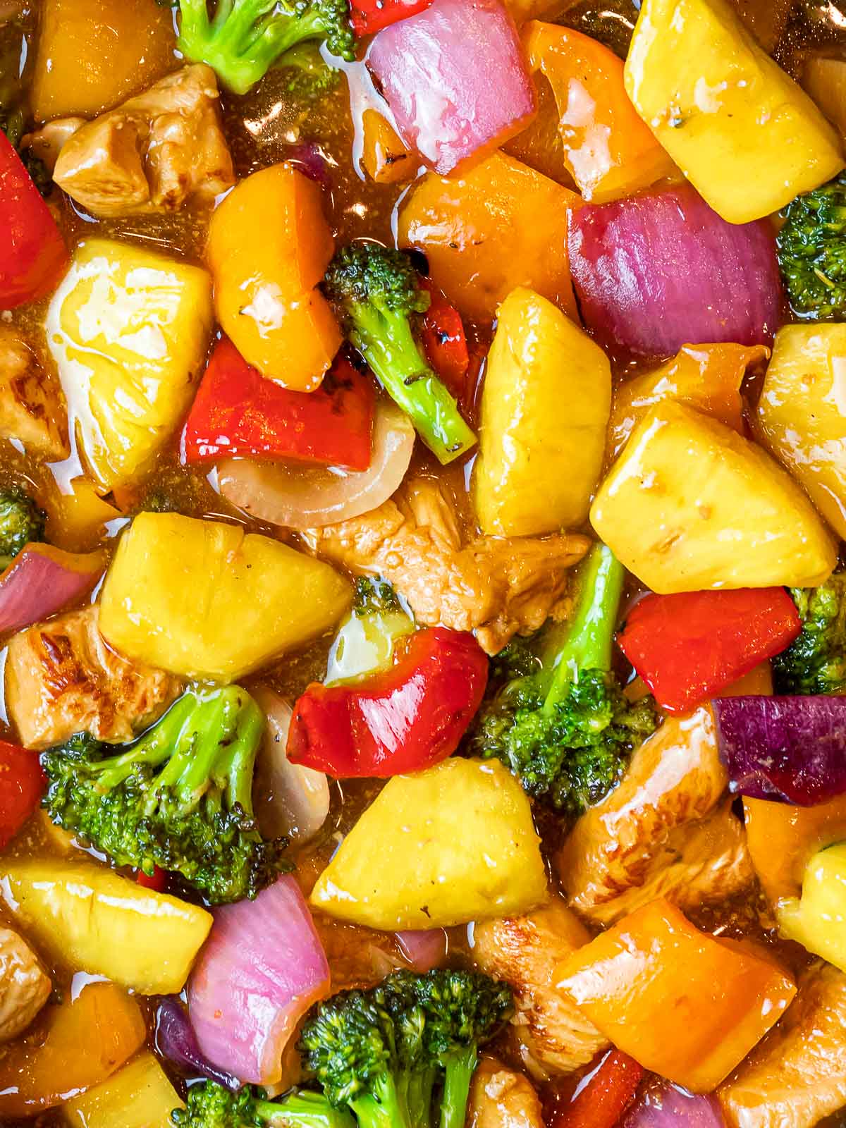 summer pineapple chicken stir fry with vegetables in a sweet and tangy sauce