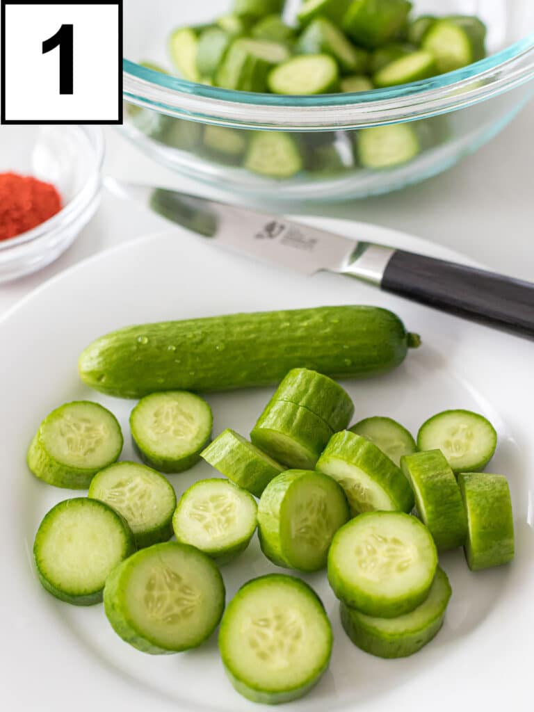 cocktail cucumbers cut into pieces on a white plate