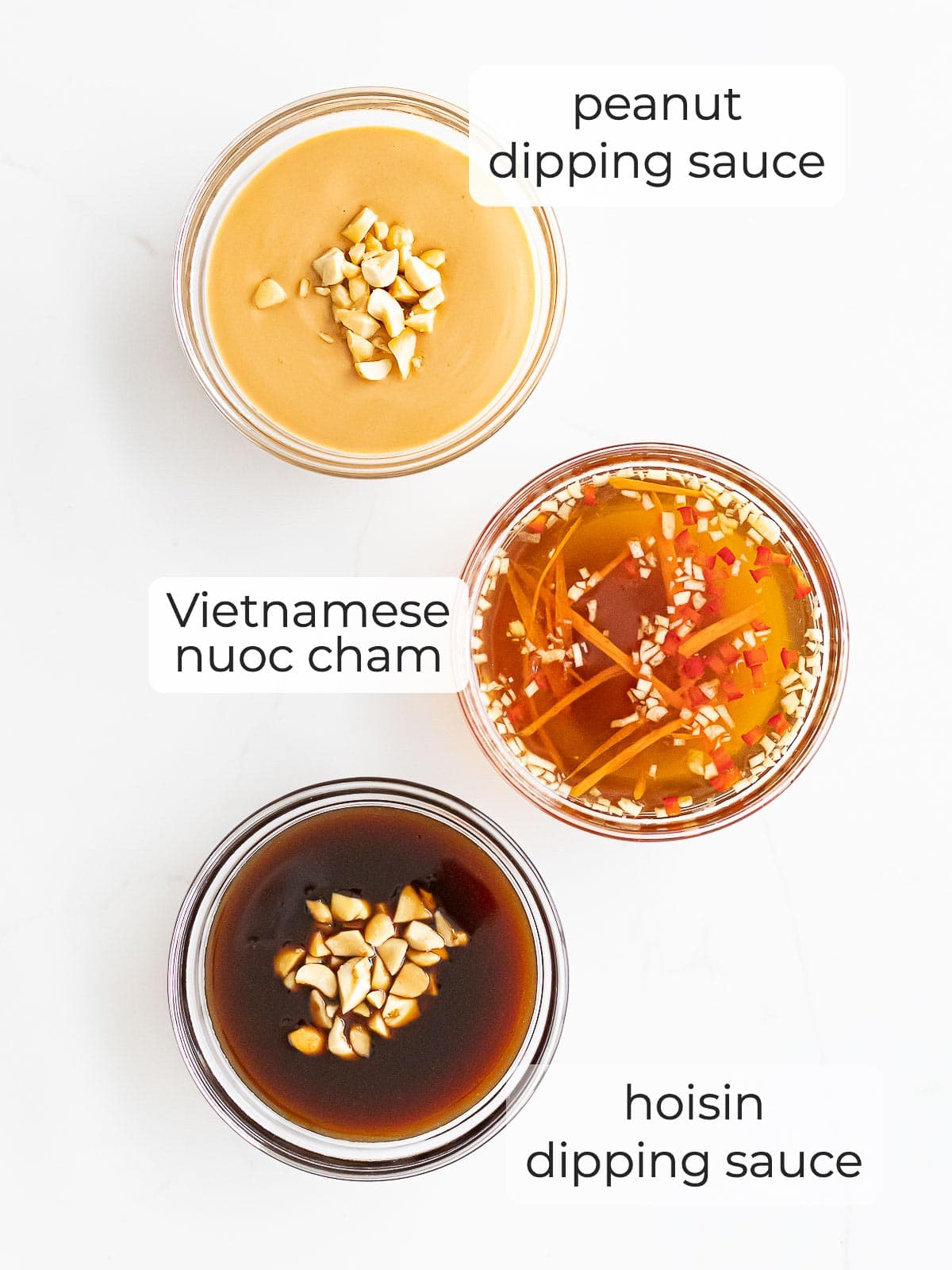 three varieties of spring roll dipping sauces including peanut, hoisin, and nuoc cham sauce