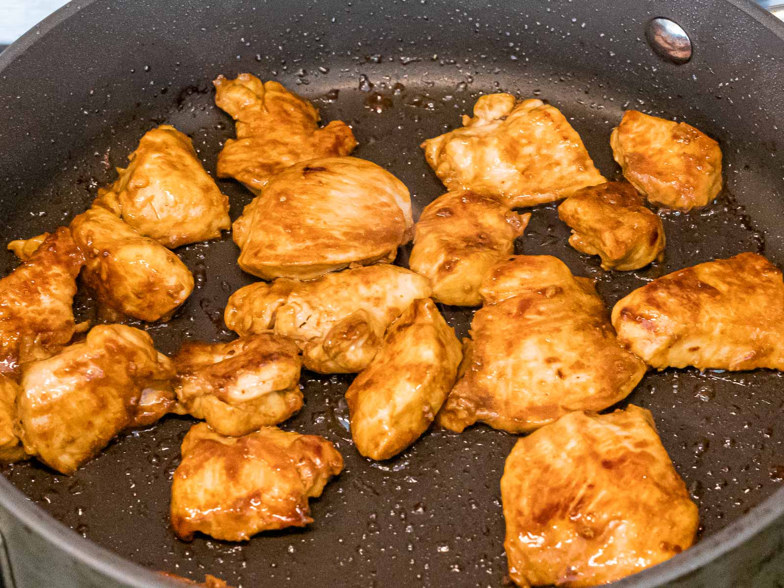 chicken stir fried in a pan