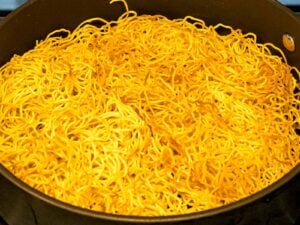 Chinese egg noodles pan fried until crispy