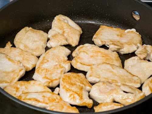 chicken breast stir fried in a pan