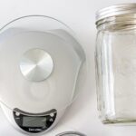 how to make yeast water with a photo of a scale, raisins, and mason jar