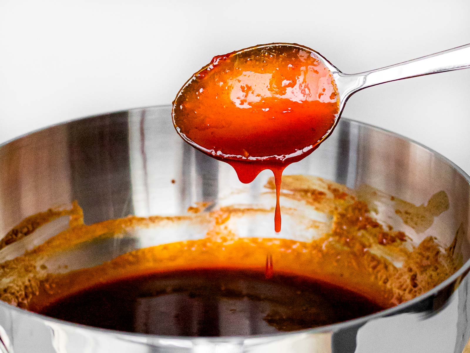 gochujang sauce dripping off a spoon