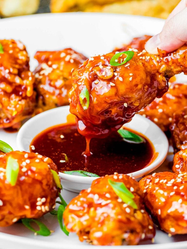crunchy Korean fried chicken wings dipped into a sweet and spicy gochujang sauce