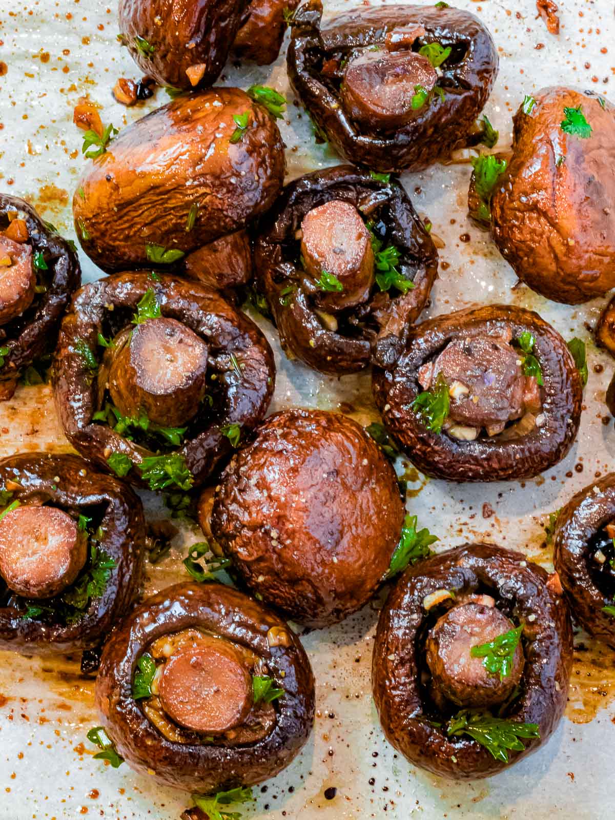 overhead of whole oven roasted mushrooms with garlic and balsamic vinegar