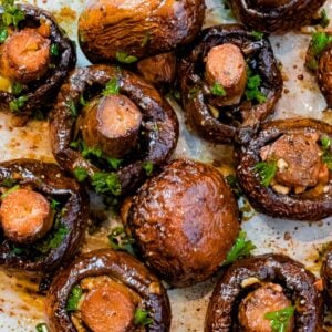 close up of roasted mushrooms with garlic and soy sauce sprinkled with parsley