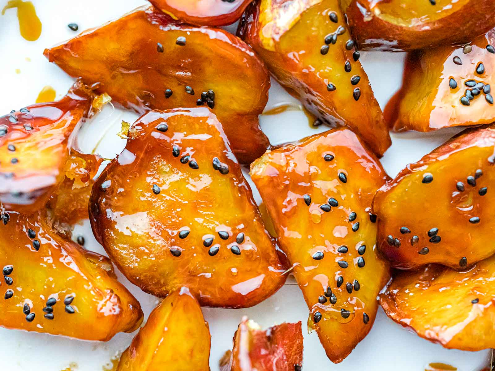 close up of Japanese candied sweet potatoes with caramelized coating and black sesame seeds