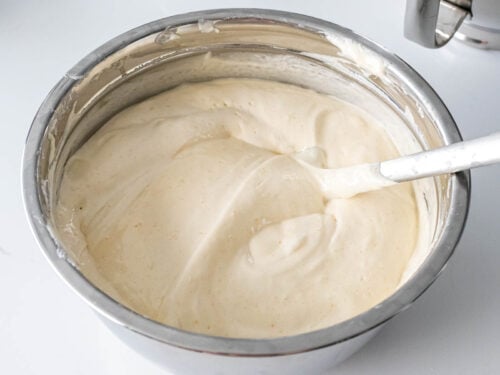 light and fluffy chiffon cake batter in a metal bowl with a spatula