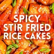 spicy stir fried rice cakes text overlay on a photo of tteokbokki