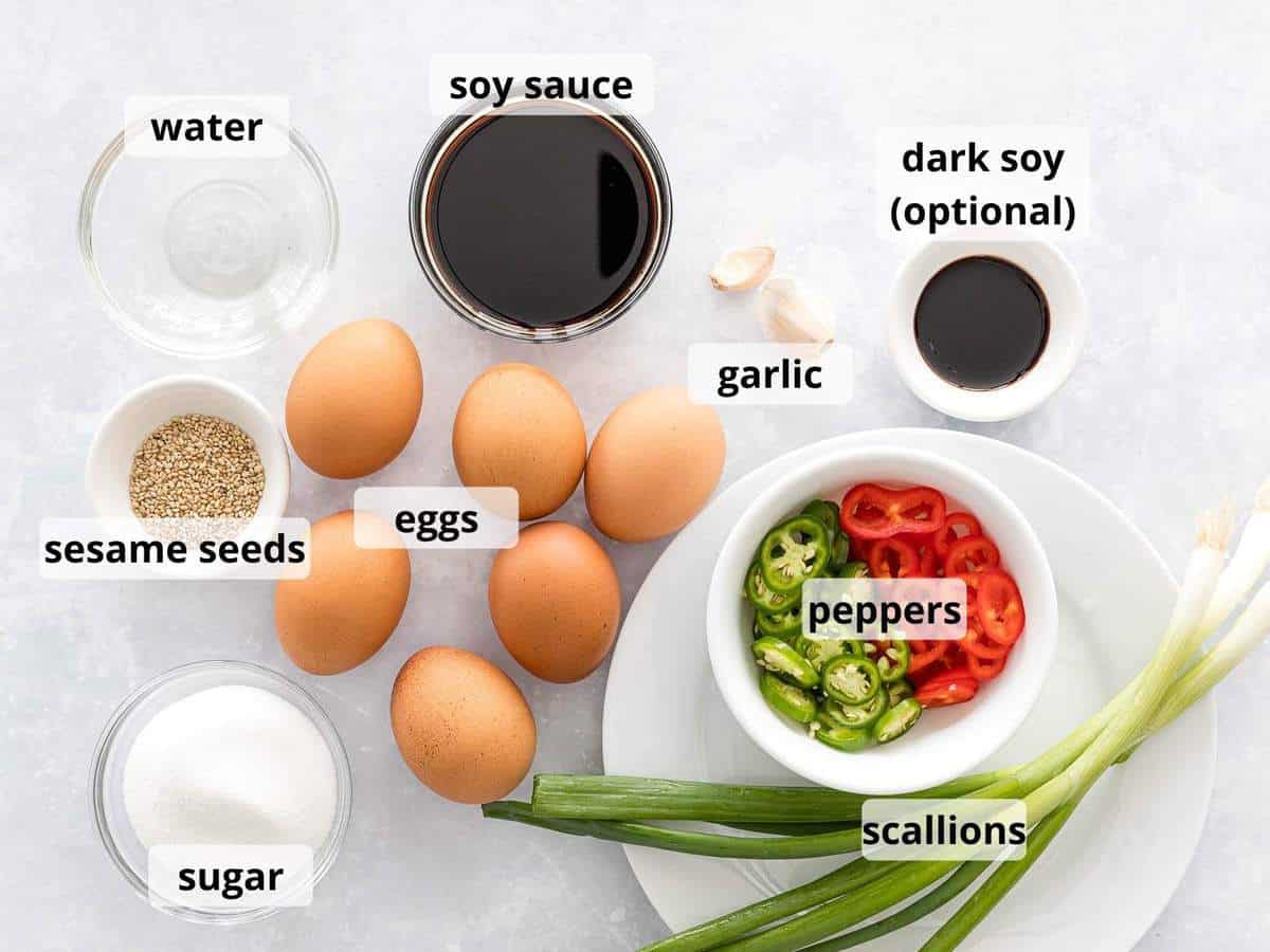 Ingredients for mayak eggs in small bowls with text label on top.