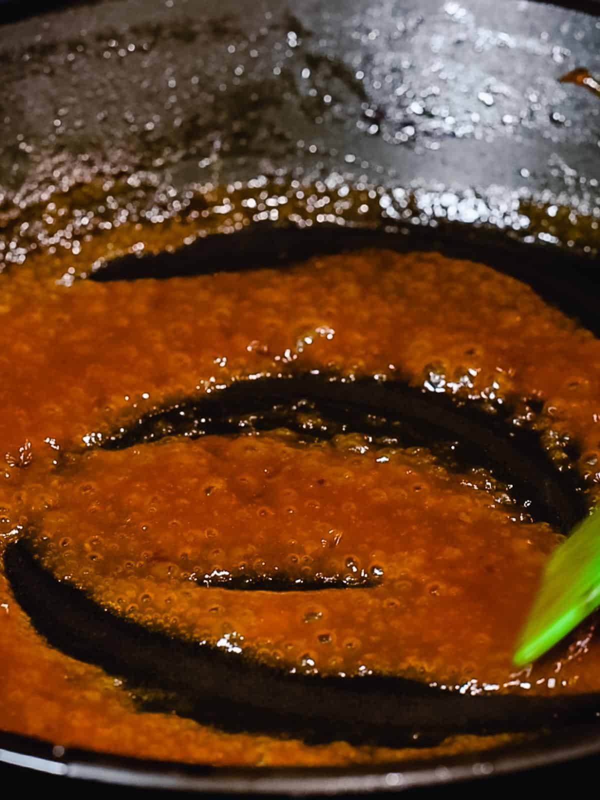 Sauce for hamburg steak reducing in a pan.