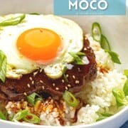 Hawaiian loco moco with sunny side up egg and burger over rice.