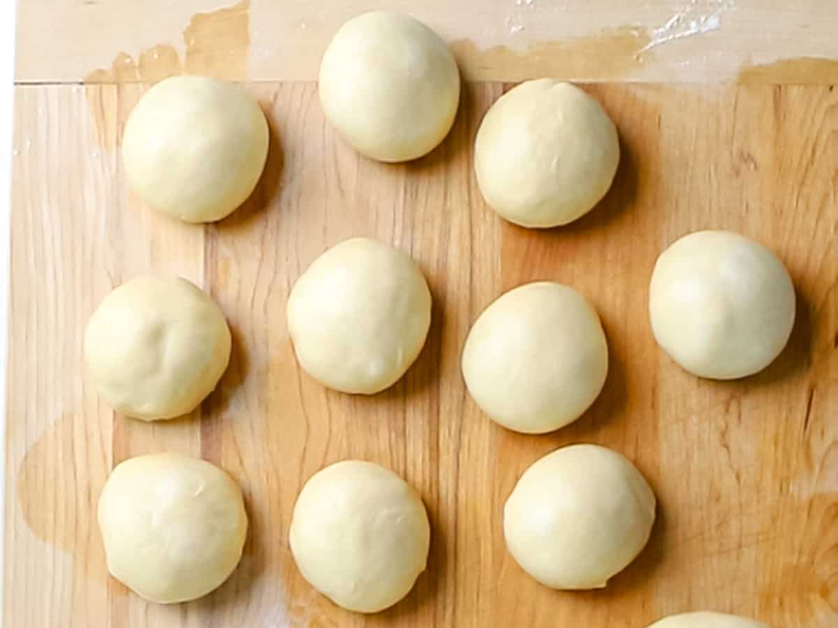 Brioche dough formed into rolls.