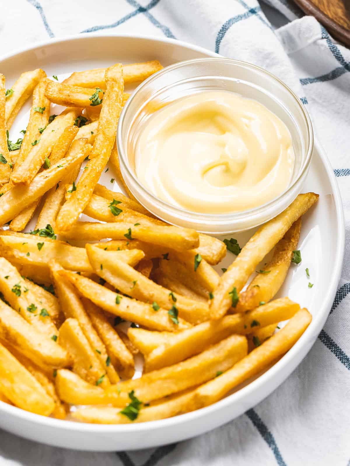 Garlic Aioli next to French fries.