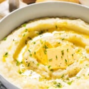 Garlic mashed potatoes with text overlay.