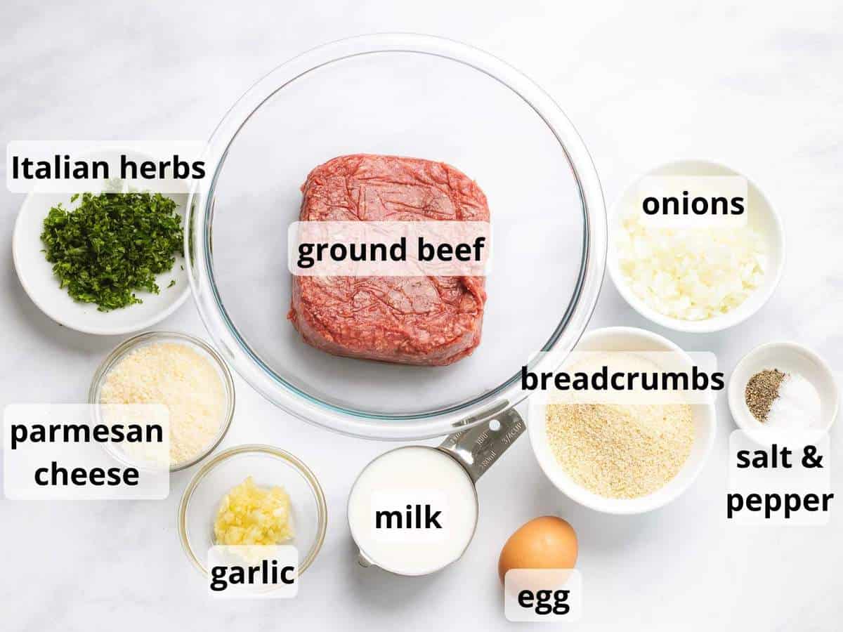 Ingredients for Italian meatballs including ground beef, breadcrumbs, parmesan cheese, and Italian herbs.