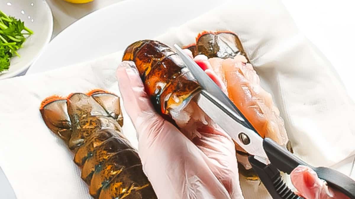 Kitchen shears used to cut and butterfly lobster tail.