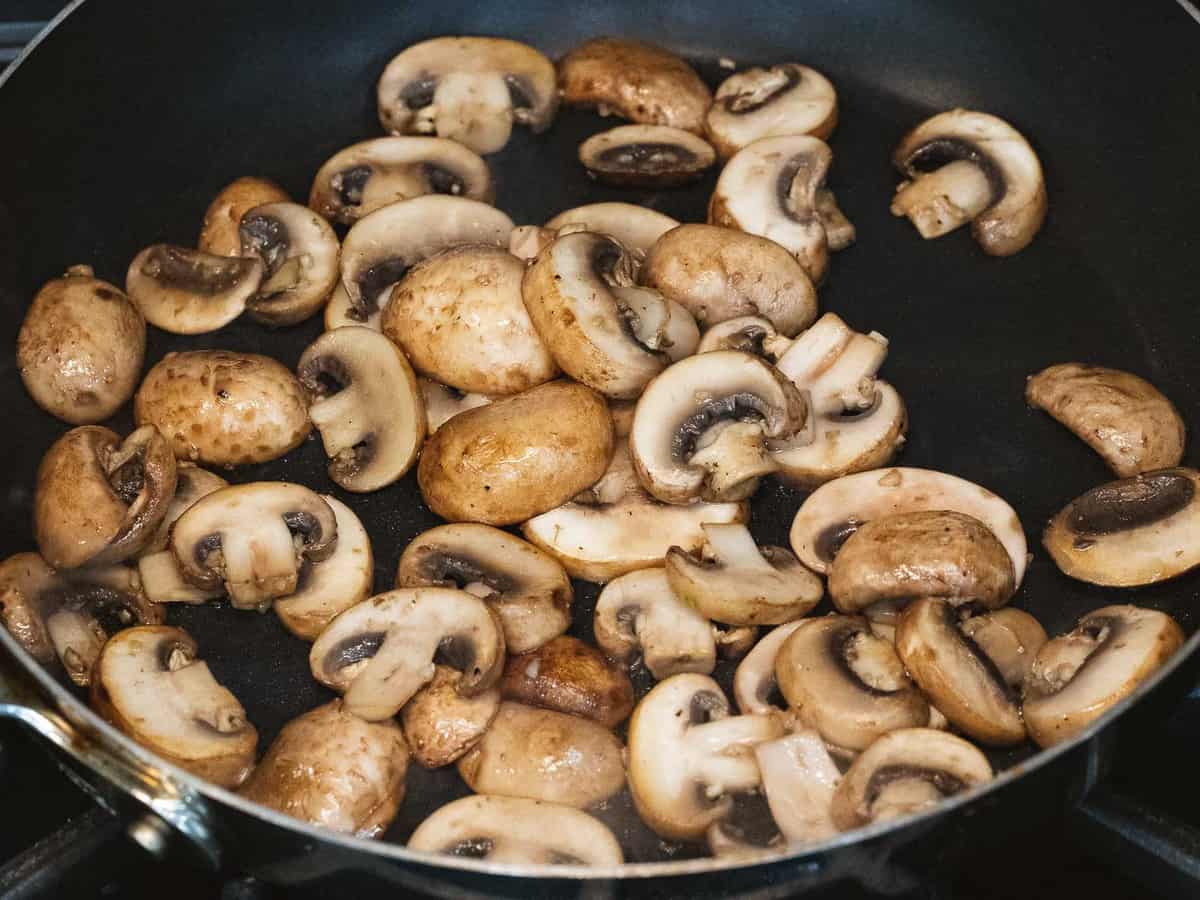 Sautéed mushrooms in a pan.