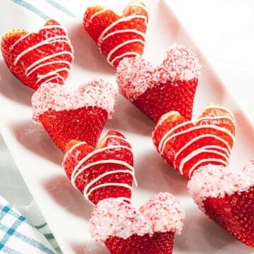Strawberry hearts with white chocolate and sprinkles.